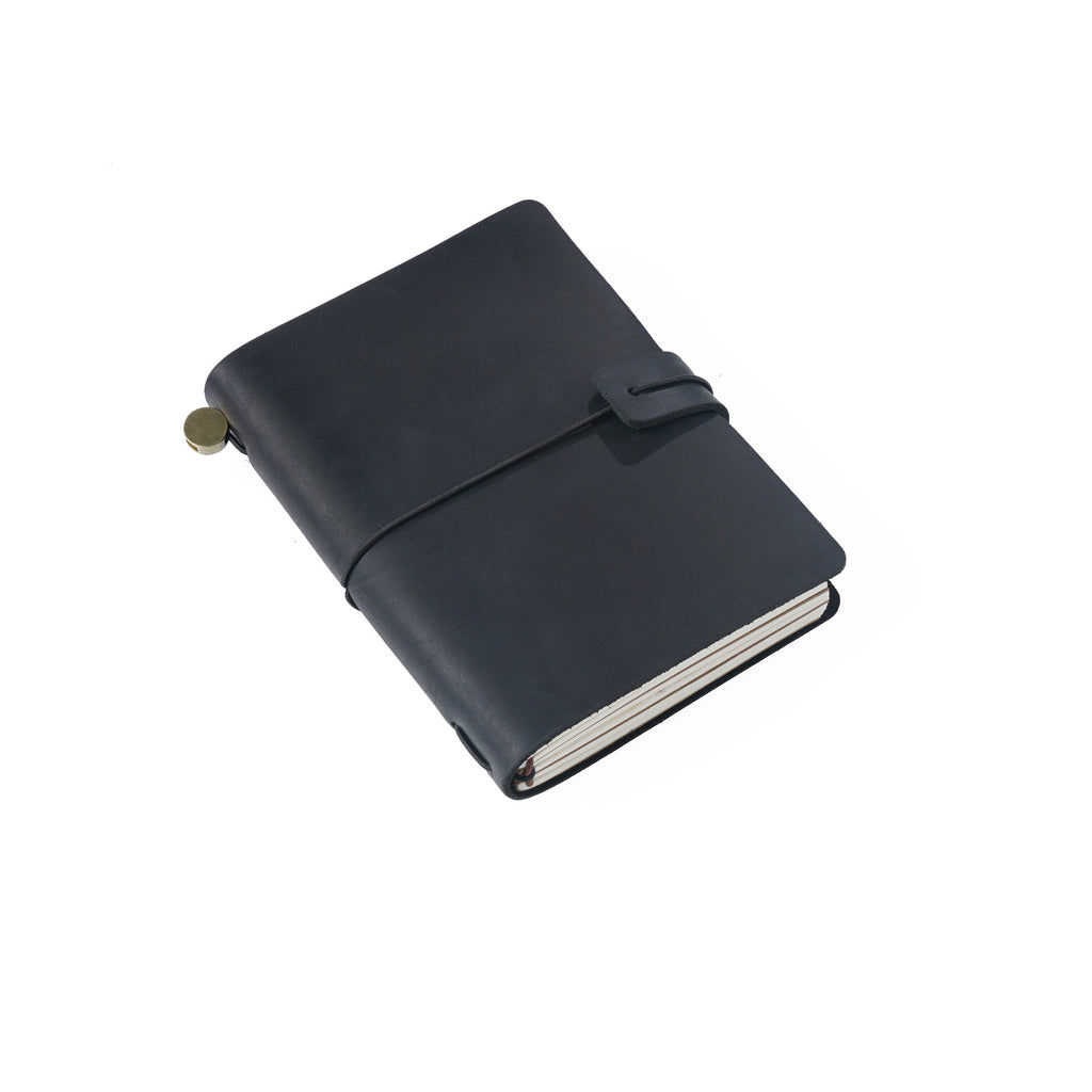 Passport-size leather journal in black with an elastic band closure