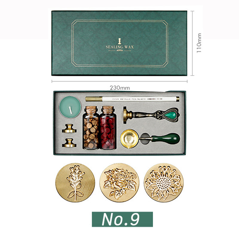 Wax seal kit with flower bouquet, rose and sunflower stamp heads, brown and dark red wax beads in a green box