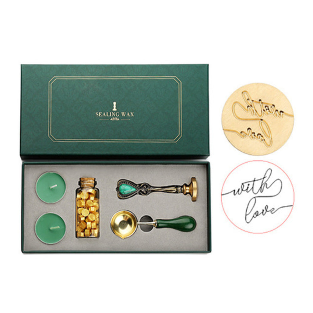 Wax seal set with with-love script stamp, gold wax beads, two tea lights and melting spoon in a green box