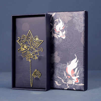 Leo zodiac bookmark in brass-tone metal with chain and charm in a dark blue gift box