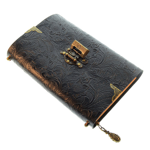 Black embossed leather journal with a metal clasp and corner guards