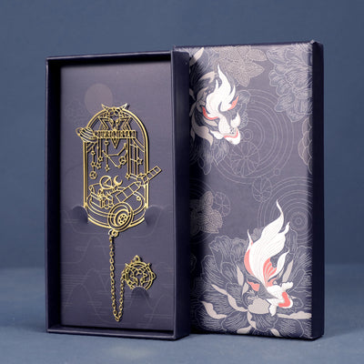 Capricorn zodiac bookmark in brass-tone metal with chain and charm in a dark blue gift box